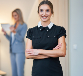 Picture of adult maid and hotel manager cleaning the room