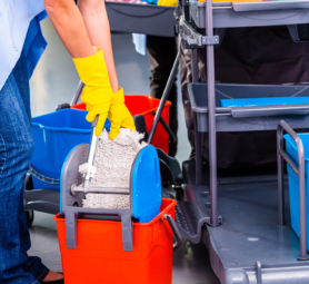Cleaning ladies mopping floor, close up on hands and tools